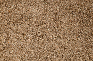 Close-up of wall with small gravel inserted into the plaster at Caceres