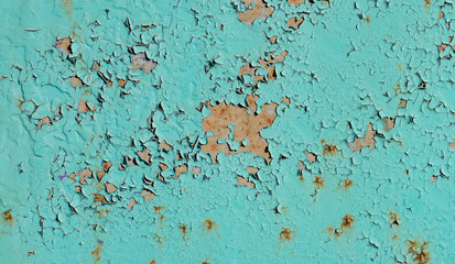 Peeling old paint on rusty metal