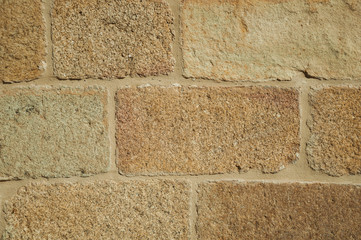 Close-up of wall with small gravel inserted into the plaster at Caceres