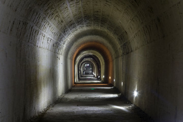 A dark, deserted underground tunnel