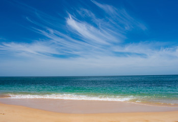 Fototapeta na wymiar Beautiful Landscape, waves on Atlantic Ocean water against blue sky. Praia de Marinha in Algarve, Portugal 