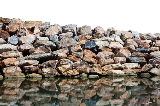Rock wall protection from the waves agaist a white background - image with space for text