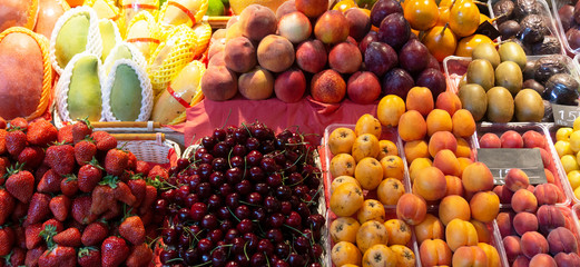 Summer fresh seasonal fruits, vegetables and berries on the market.
