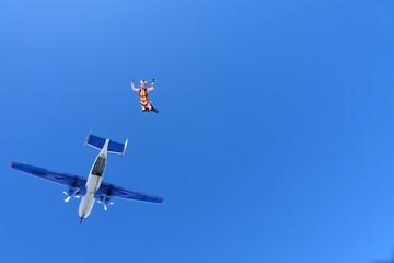 Girl dressed like a fox is flying in the sky.