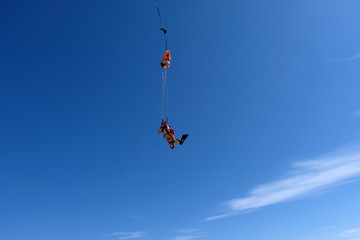 Skydiving. Girl dressed like a fox flies in the sky.