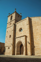 Fototapeta na wymiar The gothic Santa Maria Cathedral with big wooden door at Caceres