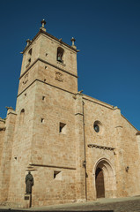 The gothic Santa Maria Cathedral with bronze statue at Caceres
