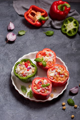 Stuffed vegetarian peppers or paprika with rice and chickpeas, vegan cooking, healthy summer lunch