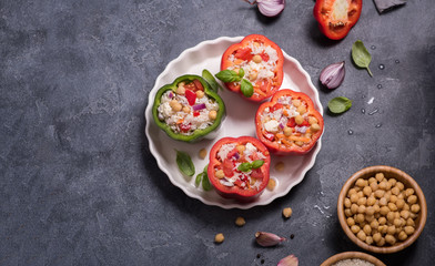 Stuffed  peppers or paprika with rice and chickpeas, vegan cooking, healthy summer lunch top view