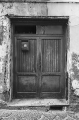 an old closed wooden access door