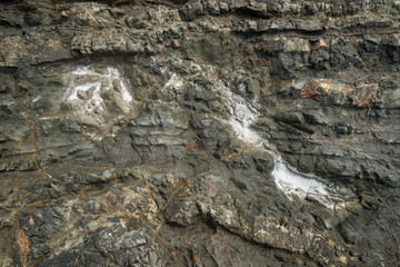 Ocean Salt crystals forming on black rocks.