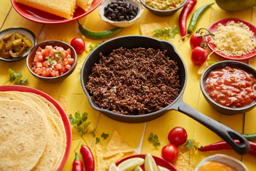 Various fresh and tasty ingredients for chilli con carne. With meat on iron pan