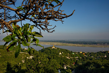 Myanmar. View of Buddhist temples from a Soon U Ponya Shin pagoda located on top of a high hill in Sagain on the banks of the Irrawaddy river.