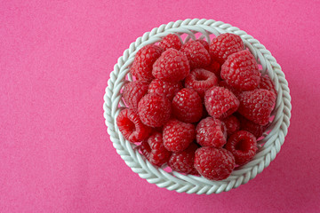 Raspberries in a porcelain bowl