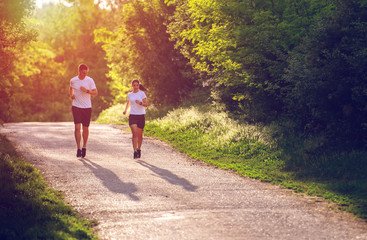 Young people jogging and exercising in nature