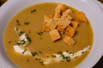 Minestrone, italian vegetable soup with pasta on wooden table. Top view