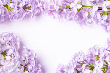 Obraz na płótnie Canvas Floral frame made of spring lilac flowers close up. spring flowers