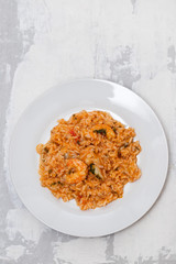 traditional portuguese dish rice with seafood in white dish