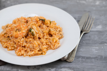 traditional portuguese dish rice with seafood in white dish