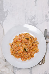 traditional portuguese dish rice with seafood in white dish