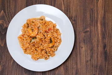 traditional portuguese dish rice with seafood in white dish