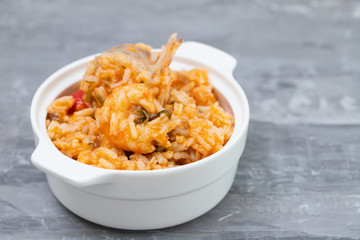 traditional portuguese dish rice with seafood in white dish