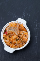 traditional portuguese dish rice with seafood in white dish