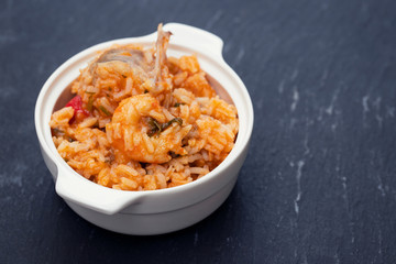 traditional portuguese dish rice with seafood in white dish