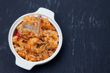 traditional portuguese dish rice with seafood in white dish