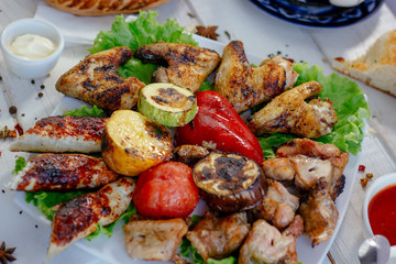 Meat plate - grilled kebabs from chiken meat, with grilled vegetables.