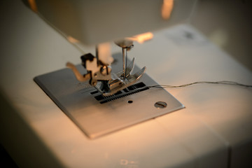 Fototapeta na wymiar sewing machine clothes