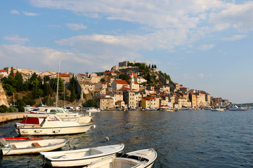 Fototapeta na wymiar Small boats in the port of Sibenik, Croatia. Sibenik is popular summer travel destination.
