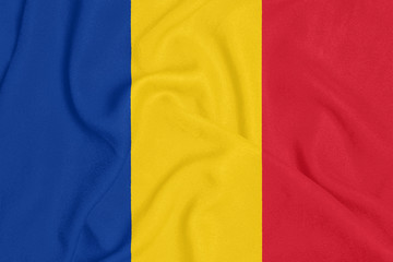 Flag of Romania on textured fabric. Patriotic symbol