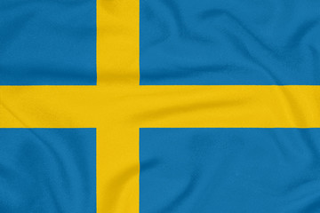 Flag of Sweden on textured fabric. Patriotic symbol