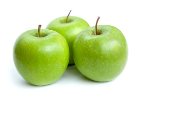 three green apples on white background