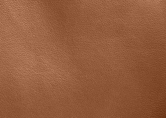  Texture of genuine leather. Brown background. The structure of the leather material close-up.