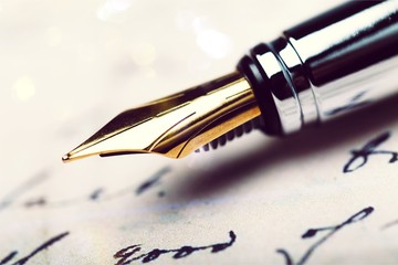 Close-up of Vintage Fountain pen on paper for business background