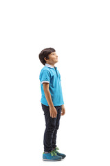 Fototapeta premium Smiling boy standing and looking upwards