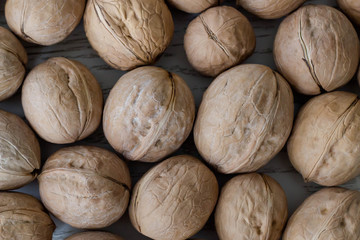 Ripe whole walnuts close-up. Natural background. Top view.