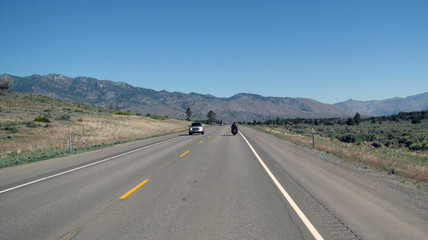 Motorcycle riding open road in Montana