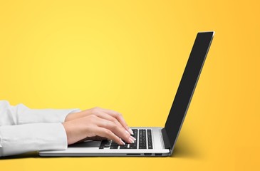 Woman typing computer.