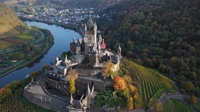 Flight around autumn Cochem castle vineyards, Mosel valley, Germany