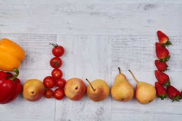 Composition of different ripe colorful fruits and vegetables. Colorful fruit and vegetables pattern or background.