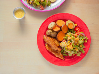 Smoked Grilled Chicken with BBQ Sauce and a mix of Potatoes and Sweet Potatoes and Green Salad with Yellow Corn