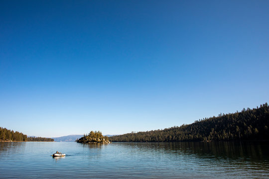 A young man floating on a raft in Lake Tahoe.