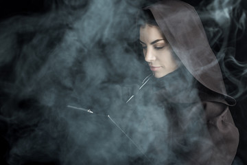 woman in death costume holding clipboard on black