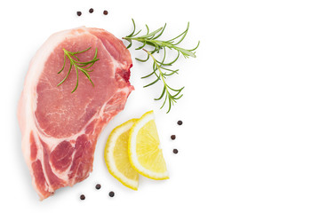 sliced raw pork meat with rosemary and lemon isolated on white background with copy space for your...