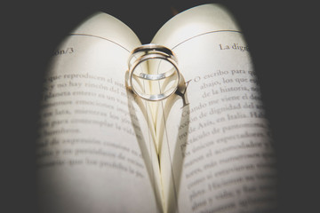 wedding ring inside a book heart