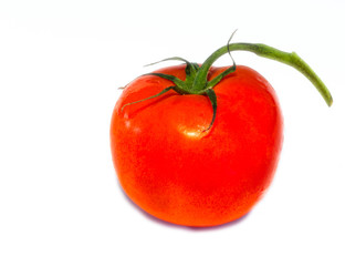 red tomato lies on the table
