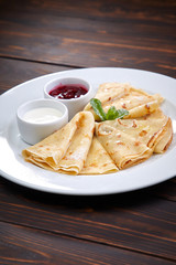 pancakes with sour cream and berry sauce